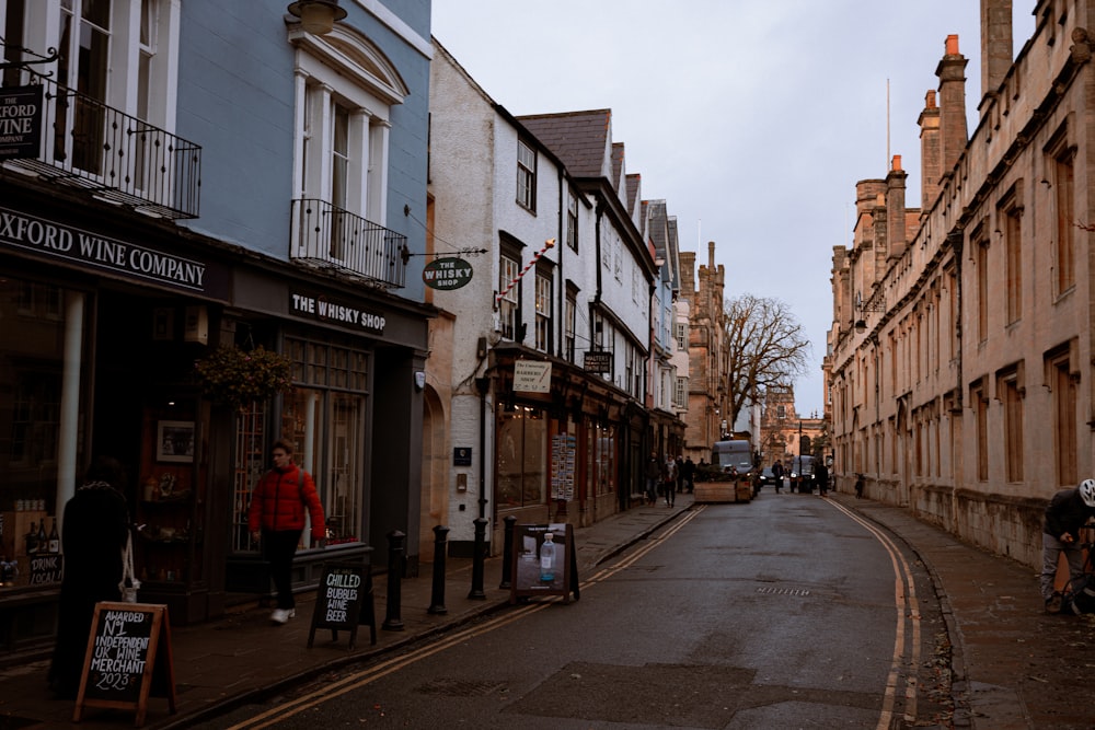 a narrow city street lined with tall buildings