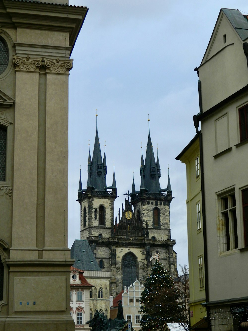 a tall clock tower towering over a city