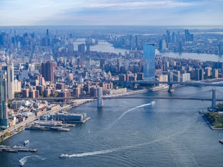 an aerial view of a city and a bridge
