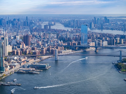 an aerial view of a city and a bridge