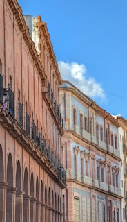a row of old buildings with balconies and wrought iron balconies