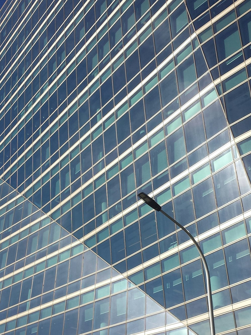 a street light in front of a tall building