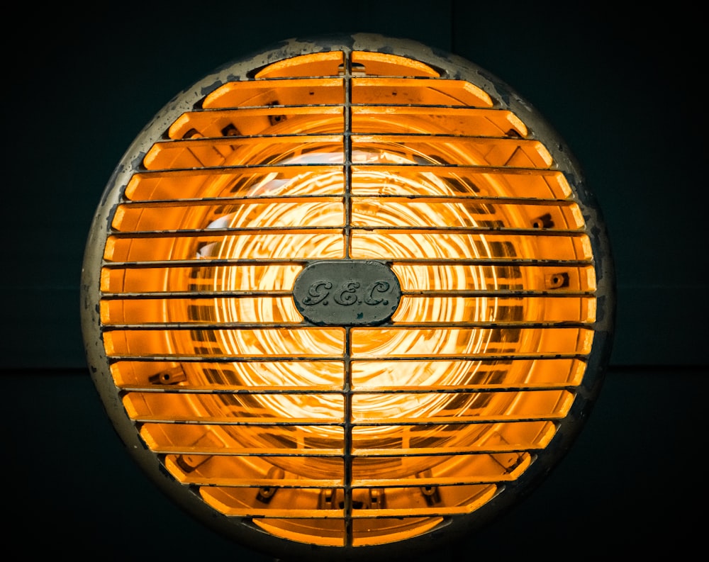 a close up of a heater with a yellow light