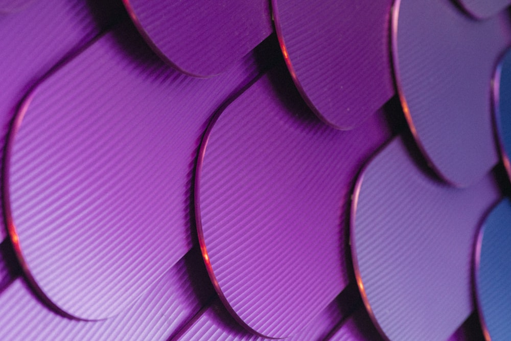 a close up of a purple and blue wall
