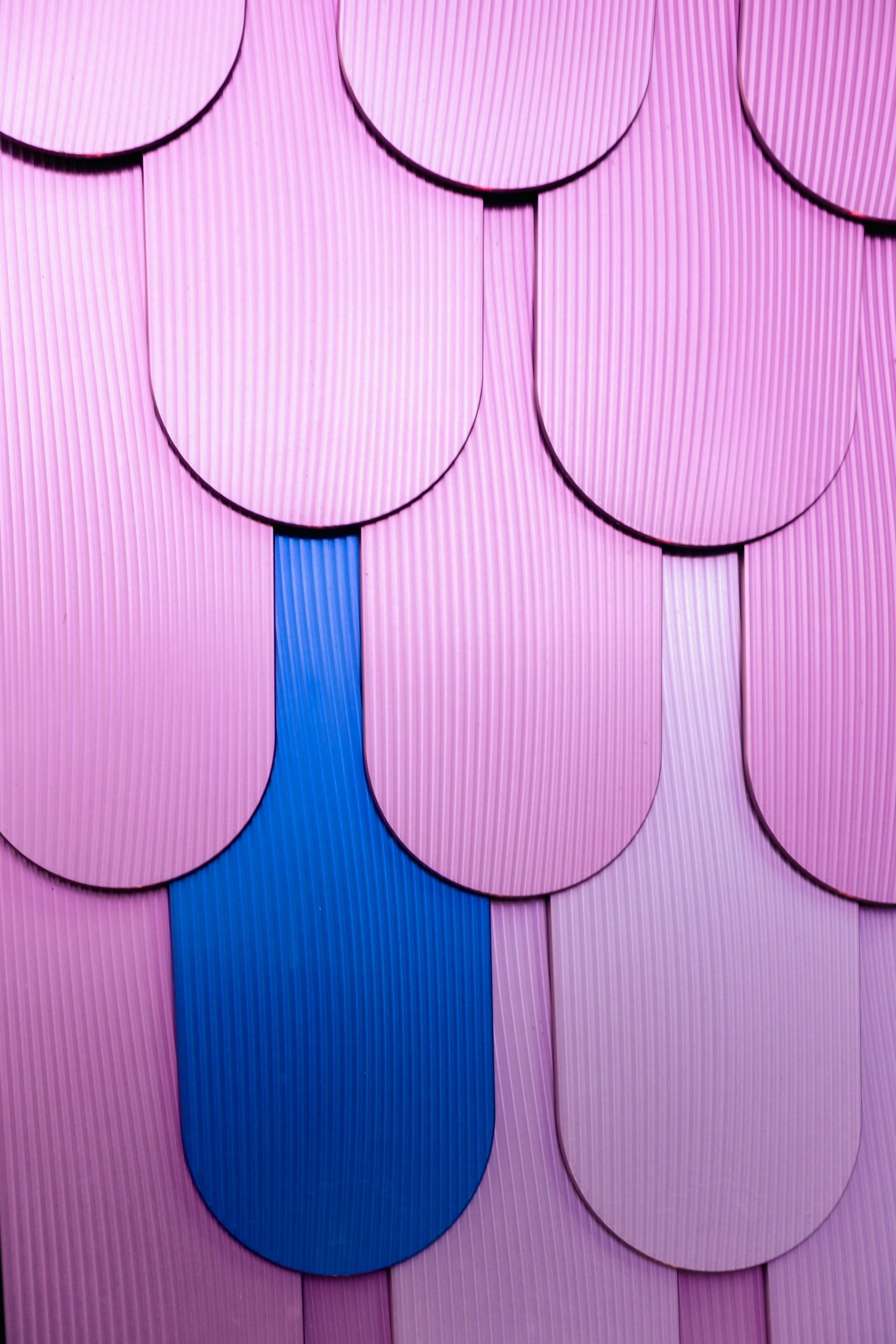 Close-up of hands skillfully laying vibrant kitchen backsplash tiles in a cozy Richmond home.