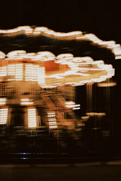 A dynamic carousel of video thumbnails with smooth golden highlights and modern interface elements on a clean white background.