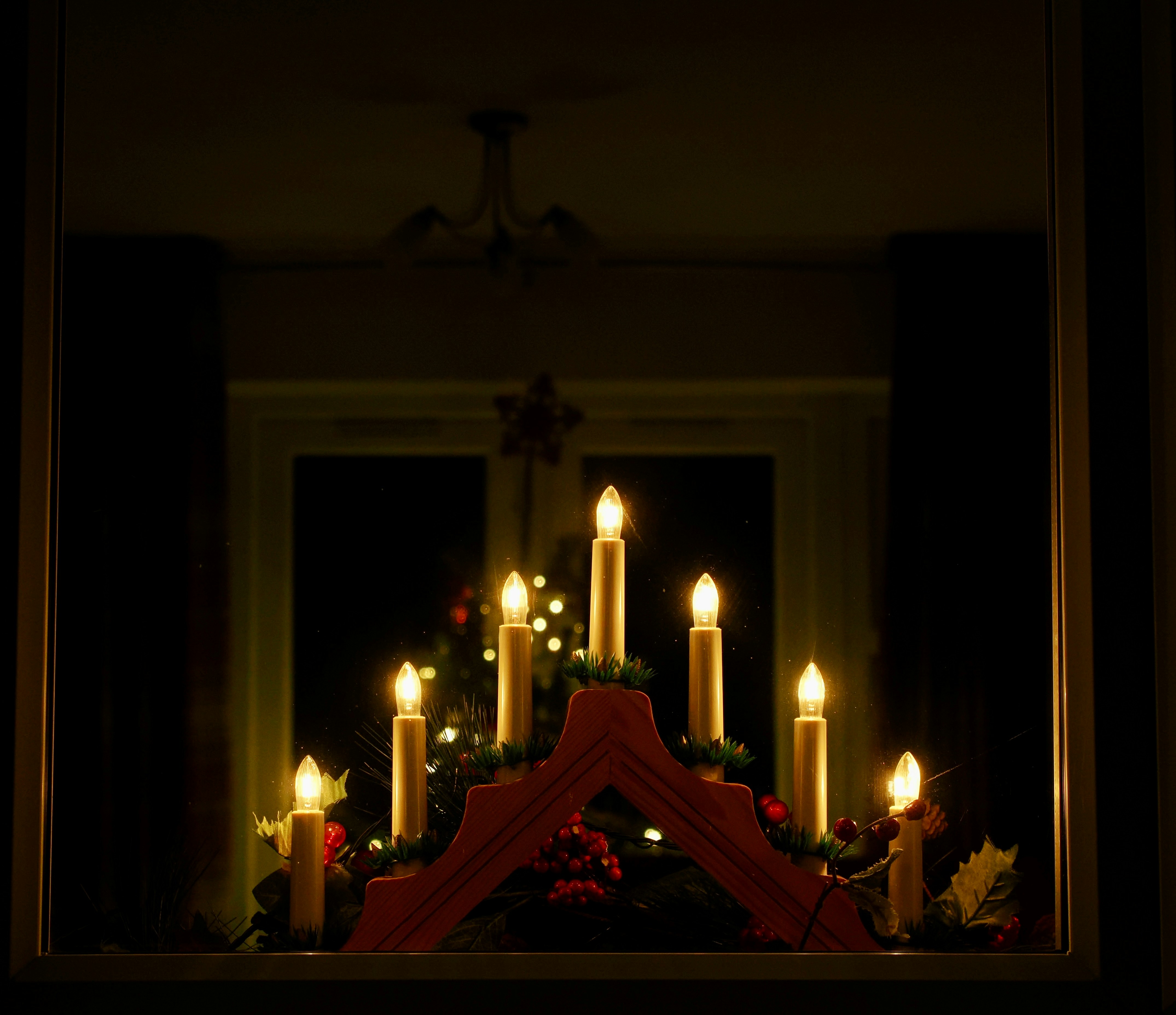 Woman applying moisturizer on her face before going to bed.