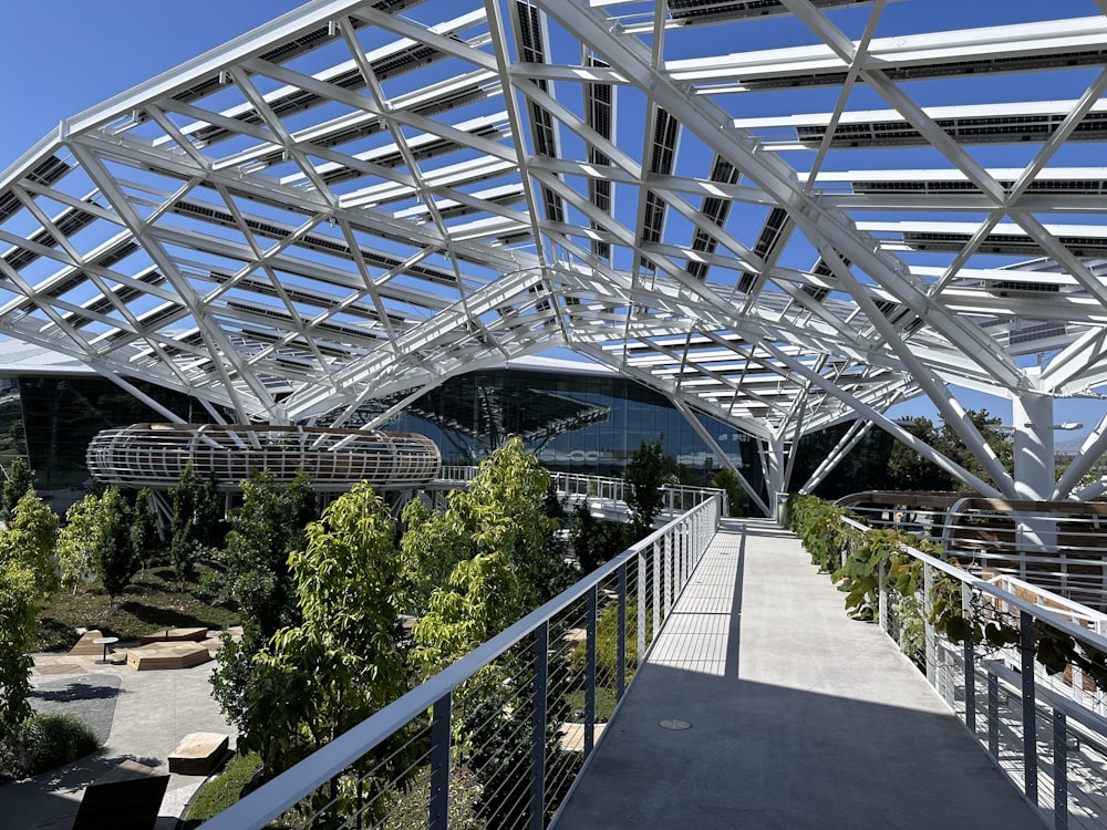 a walkway leading up to a building with a metal roof