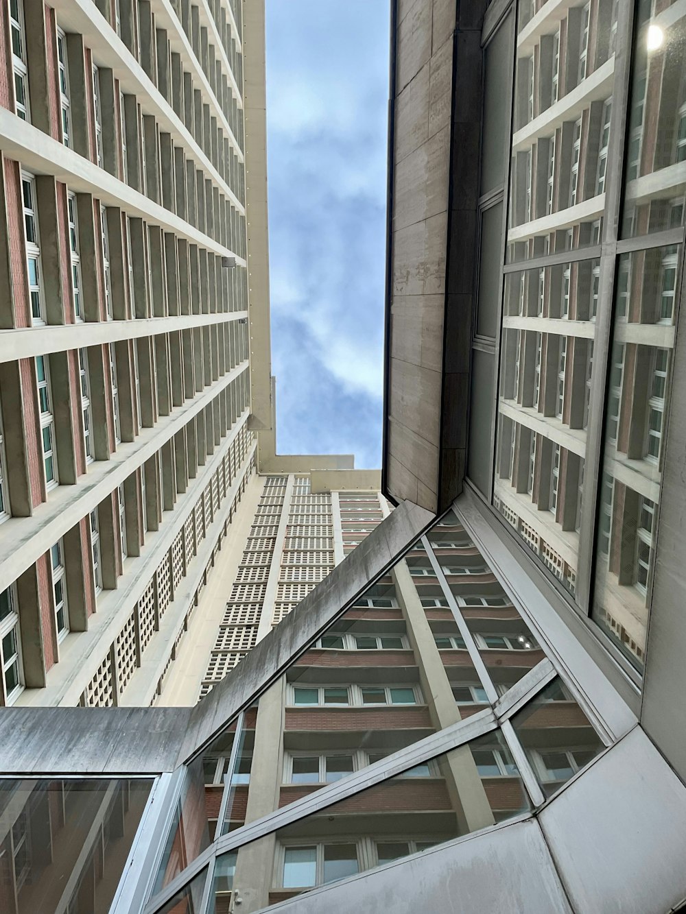 a view of a very tall building from the ground