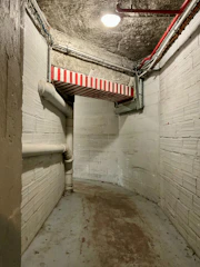 Hospital corridors with visible mechanical service installations.