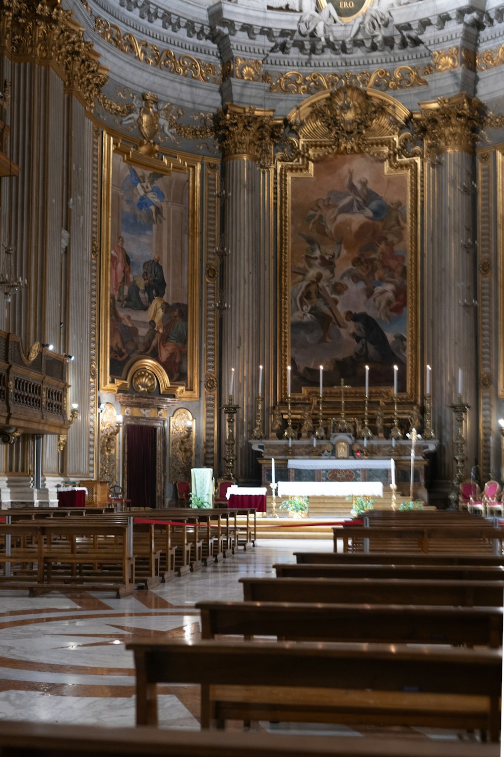 the interior of a church with a painting on the wall