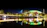 A vibrant photo of a corporate sports event with teams competing under stadium lights.