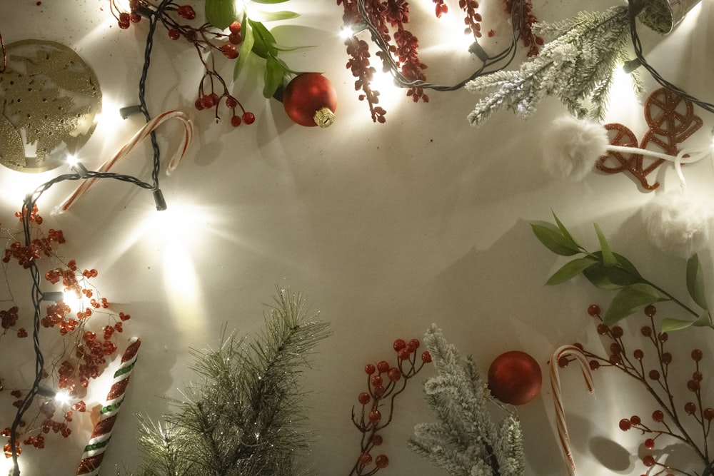 a white table topped with christmas decorations and lights