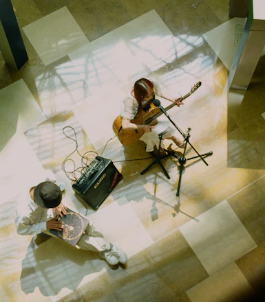 a couple of people that are sitting on the ground