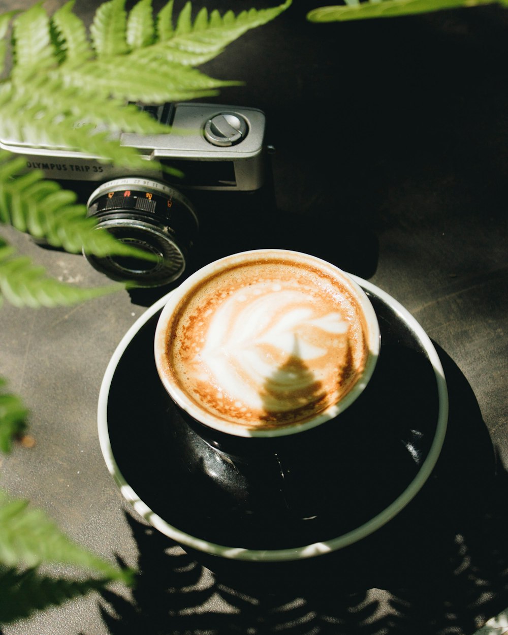 a cup of coffee sitting on top of a saucer