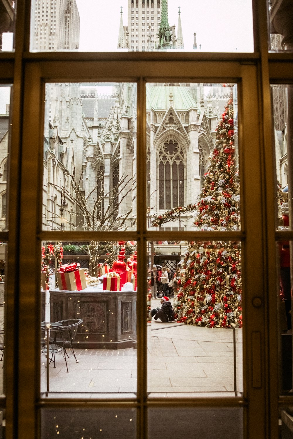 a view of a christmas tree through a window