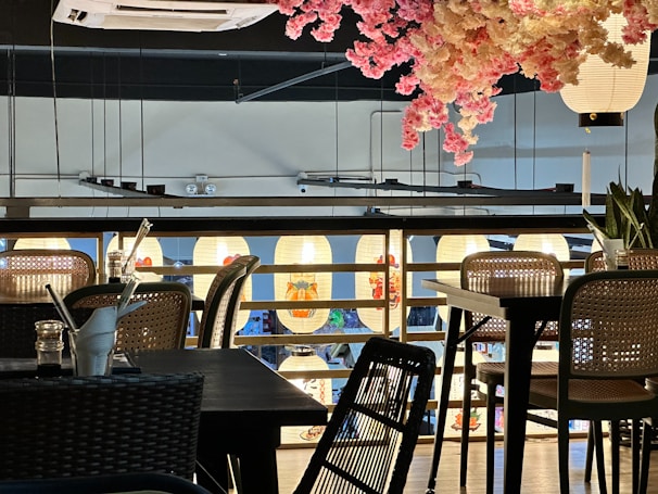 A cozy corner of the studio with cherry blossom decor and comfortable seating.