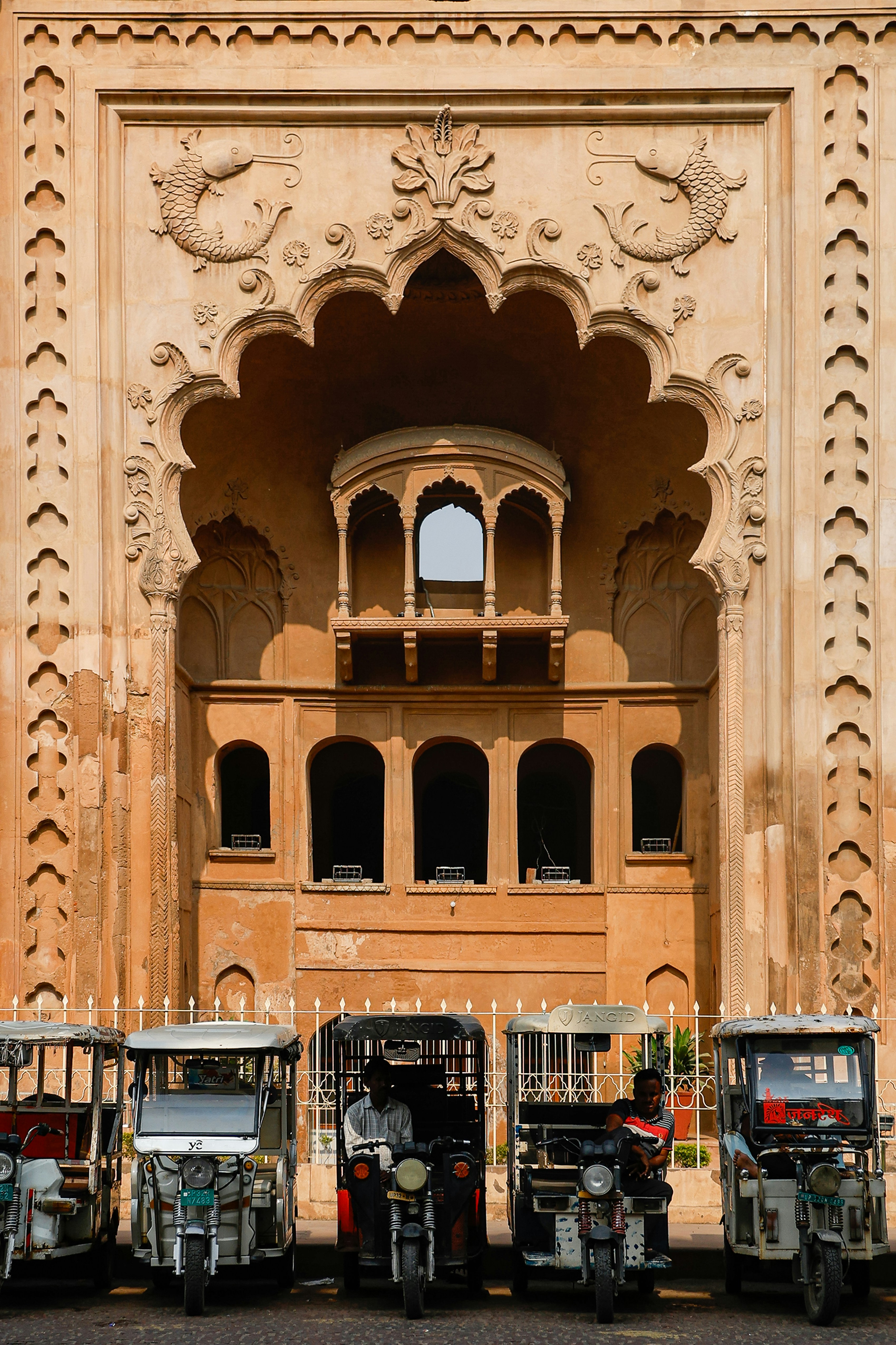 a group of vehicles parked in front of a building