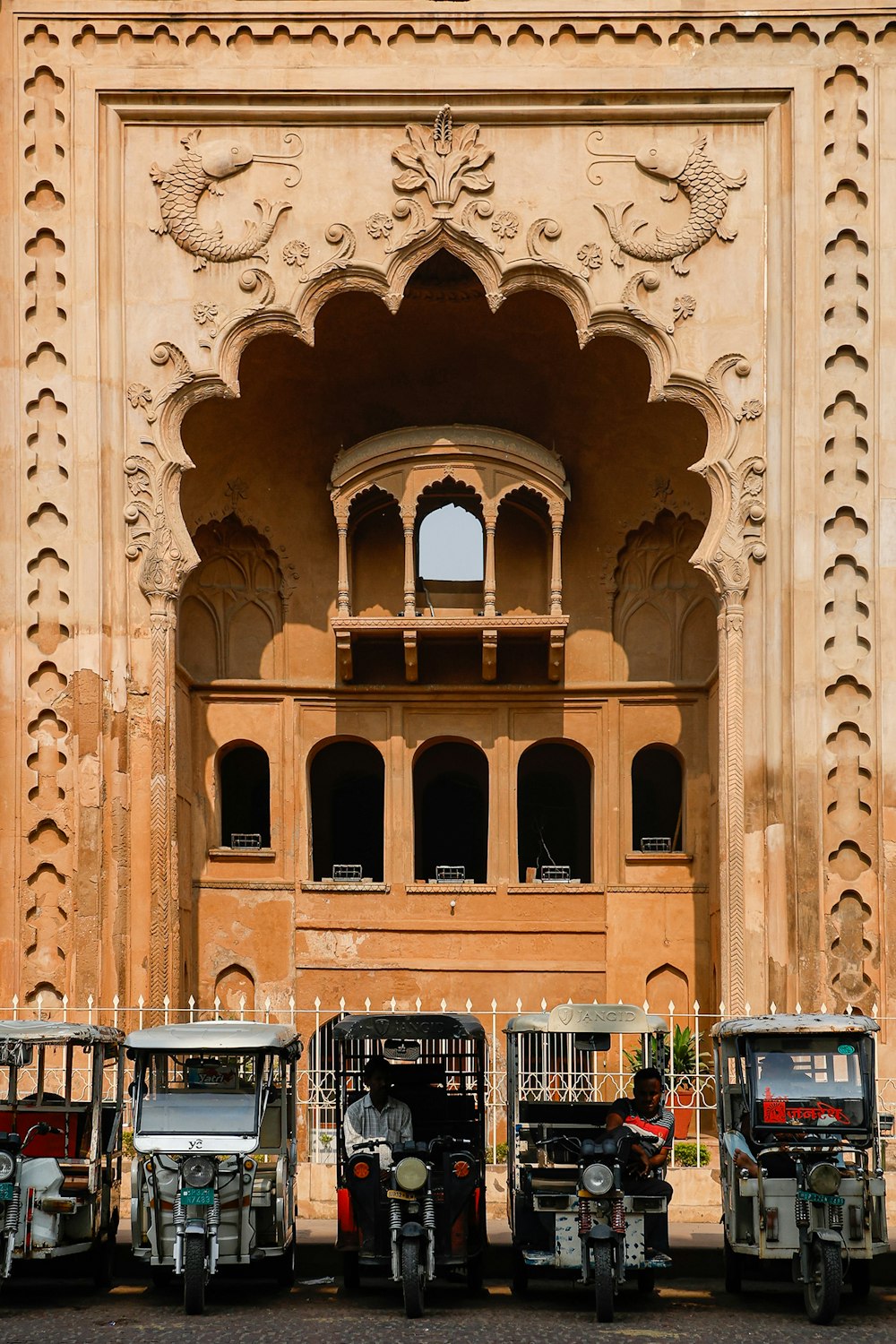 a group of vehicles parked in front of a building