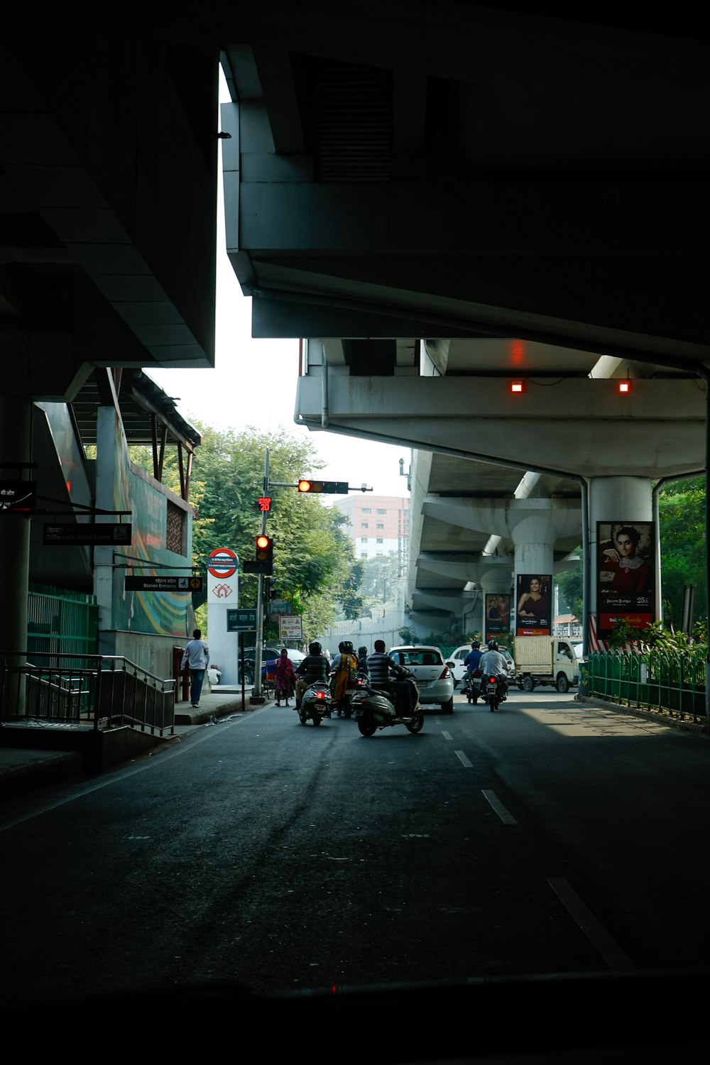 a group of people standing on the side of a road