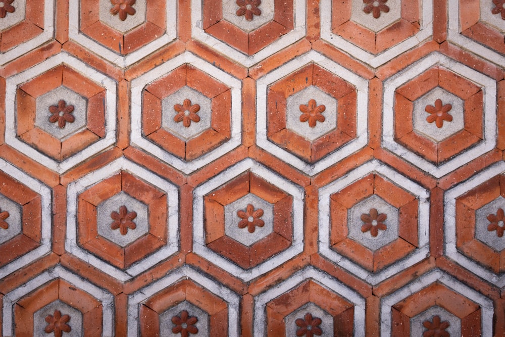 a pattern of hexagonal tiles with flowers on them