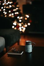 A cozy scene with printed mugs and posters arranged neatly on a wooden table.