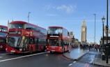 A vibrant street scene in London with red double-decker buses and Big Ben in the background.