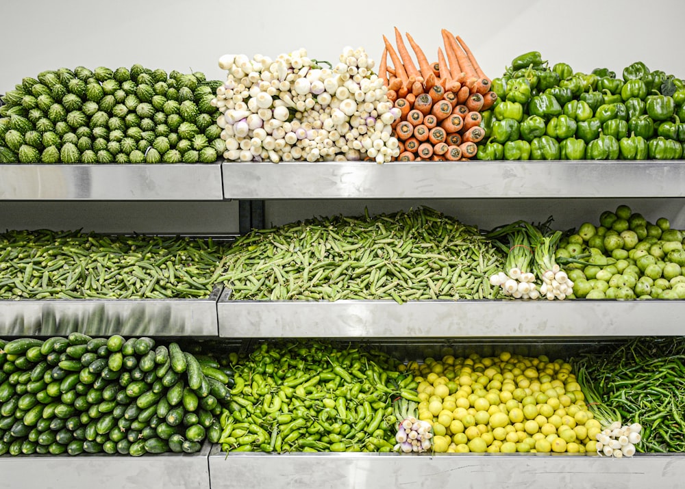 a display case filled with lots of vegetables