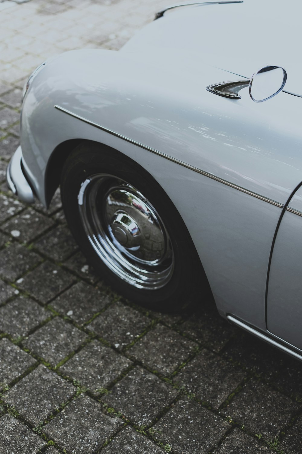 a close up of a car parked on a street