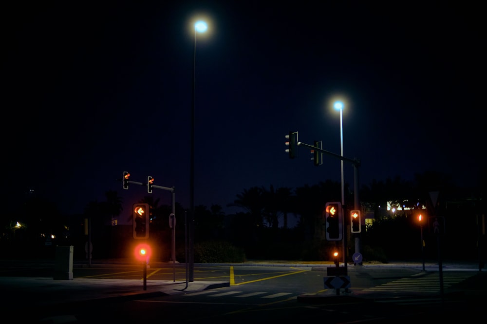 a couple of stop lights that are on a pole