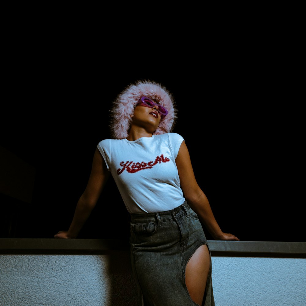 a woman in a white shirt and a skirt