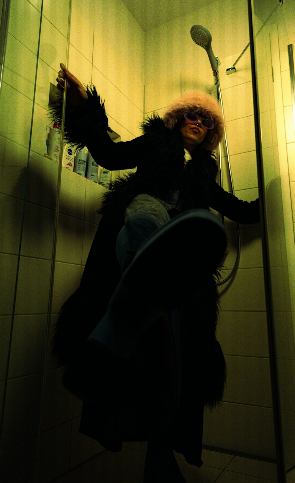 a woman standing in a shower in a bathroom