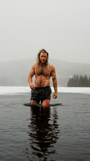 a man standing in a body of water