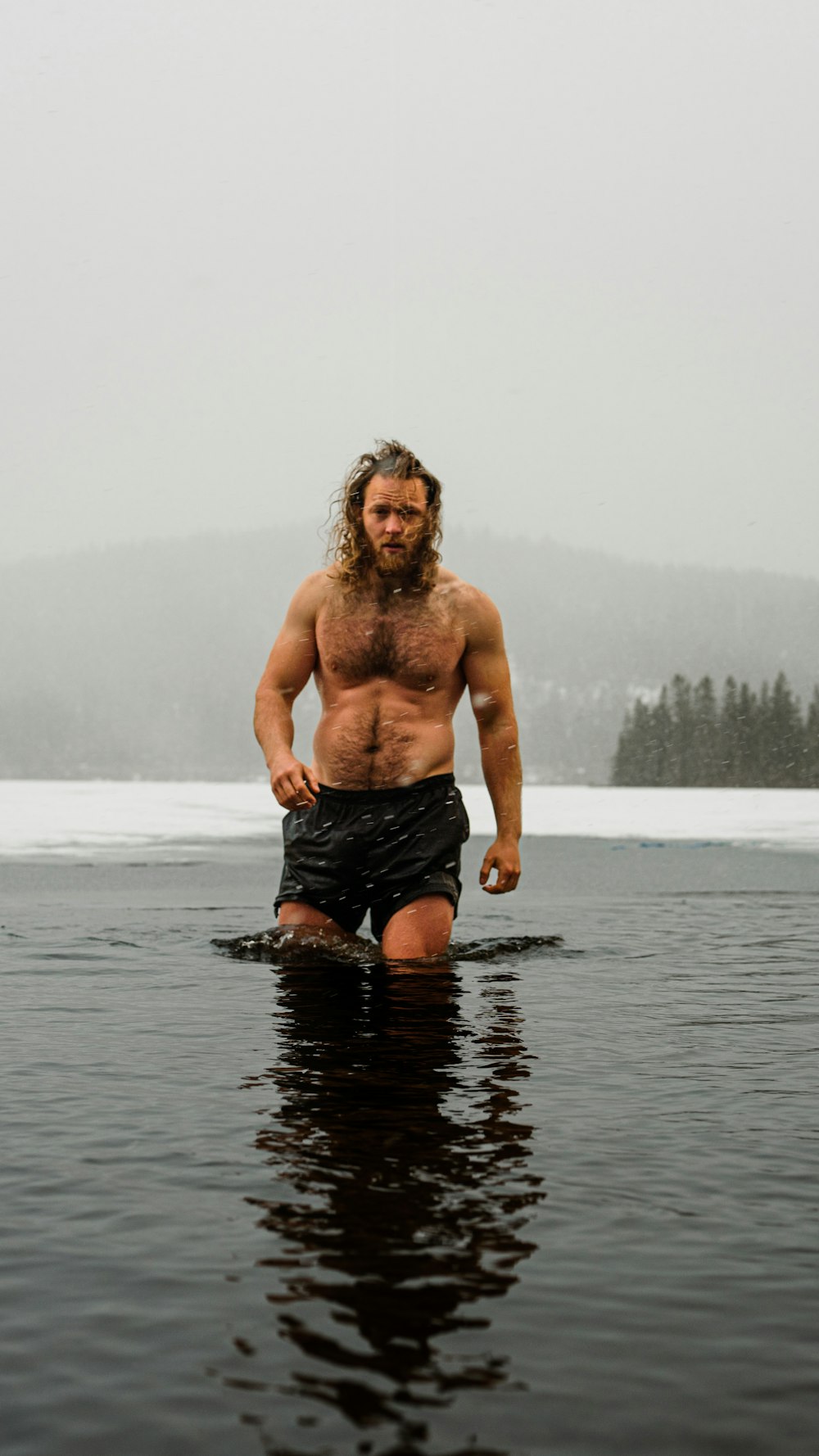 a man standing in a body of water