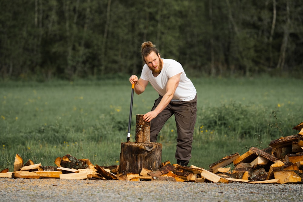 a man is chopping wood with an axe