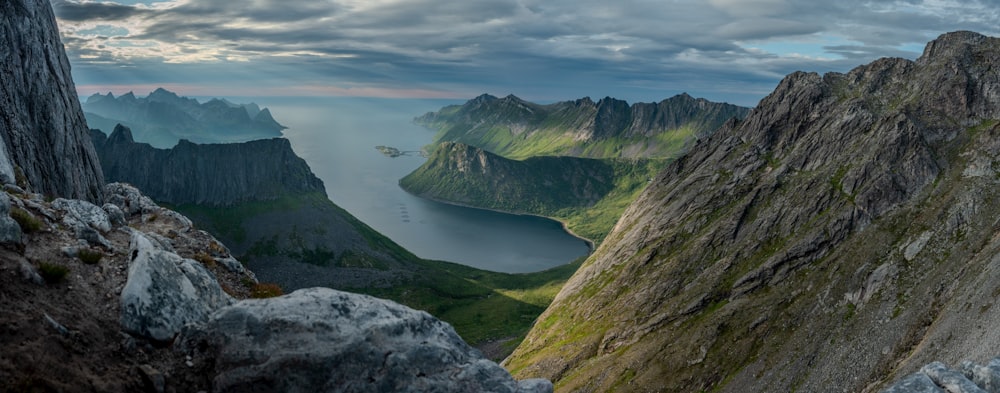 a mountain range with a body of water in the middle of it