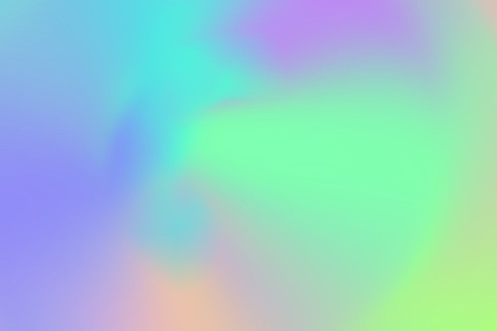 a blurry image of a rainbow colored background