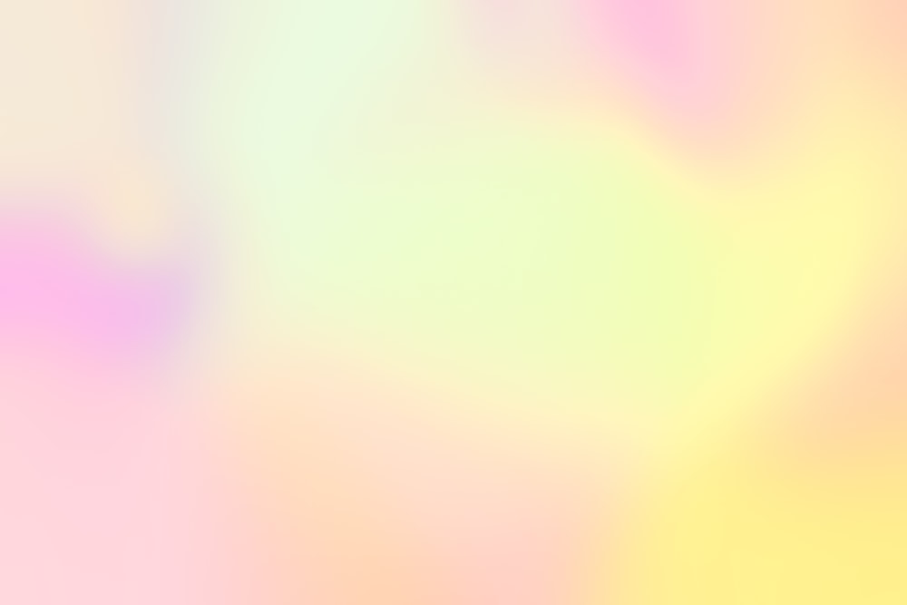 a blurry image of a yellow and pink background
