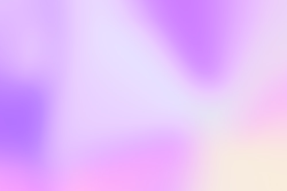 a blurry image of a purple and yellow background