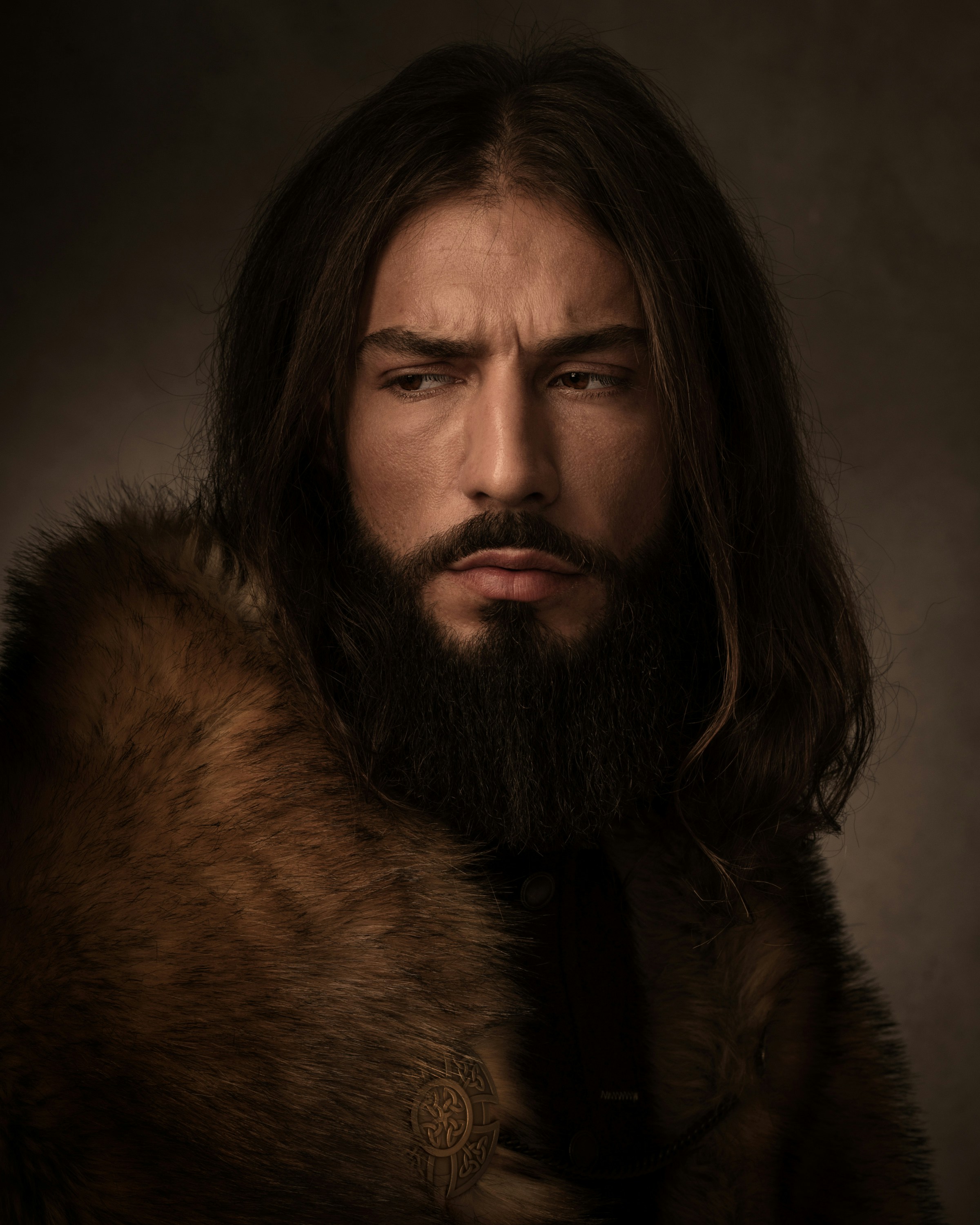 A man with long hair and a beard wearing a fur coat photo – Free ...