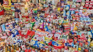 A variety of packaged food products displayed on shelves.