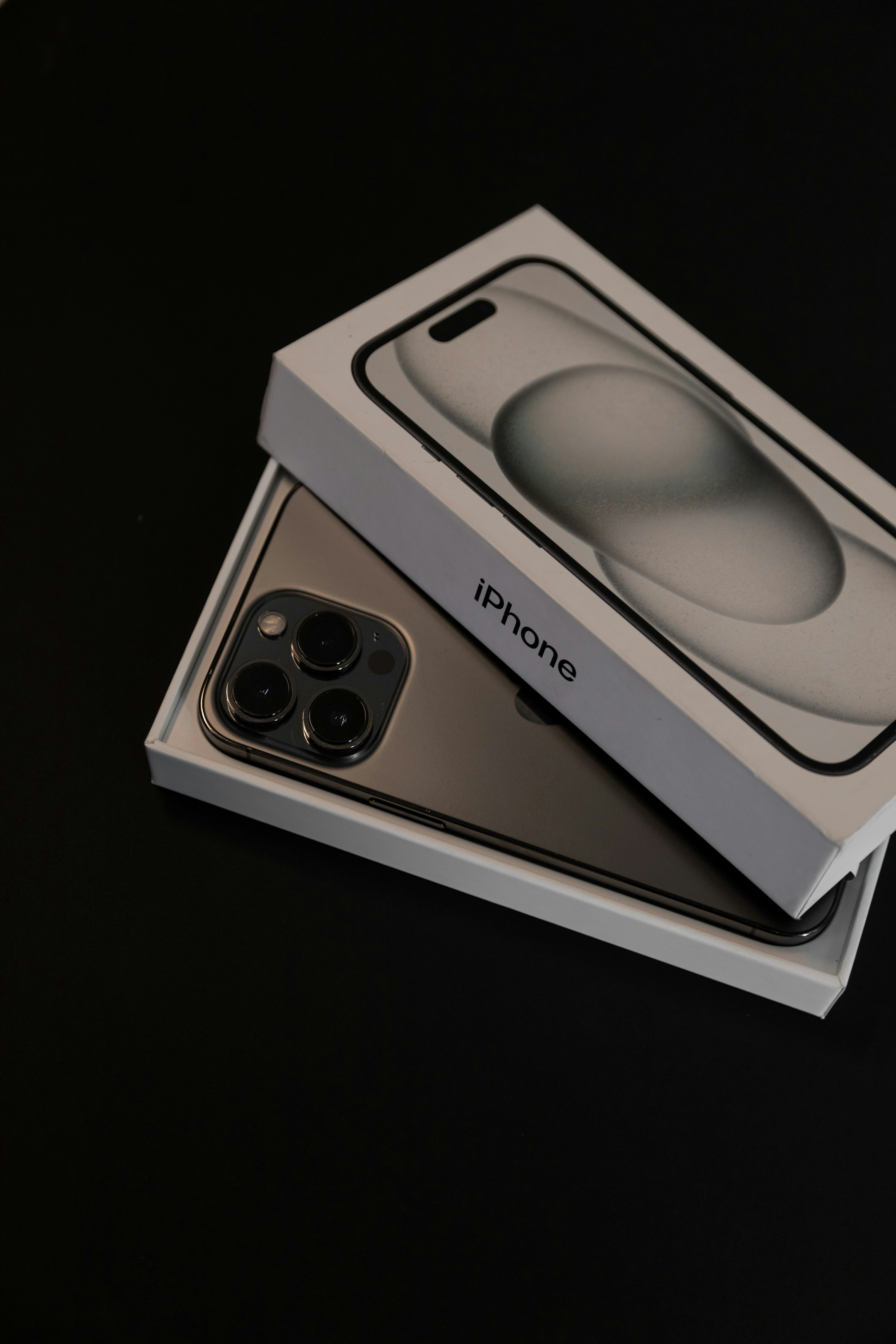 an iphone 11 pro in a box on a table