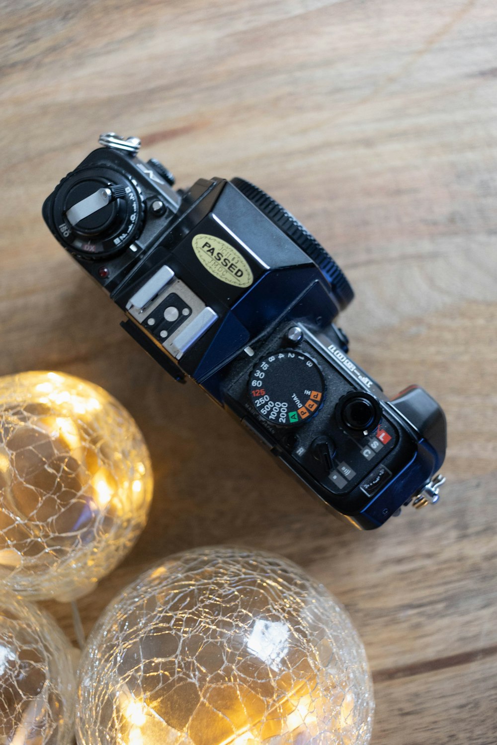 a camera sitting on top of a wooden table