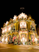 The historic facade of the sanctuary adorned with festive decorations.
