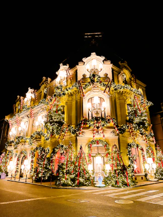 The historic facade of the sanctuary adorned with festive decorations.