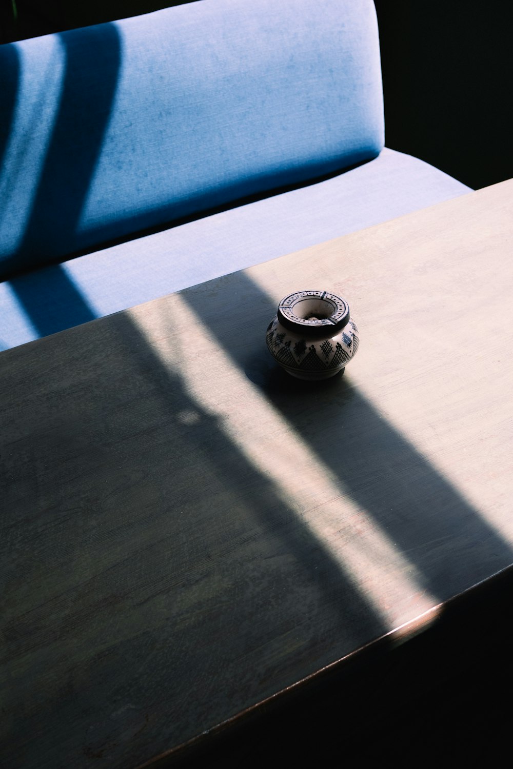 a table with a vase on top of it