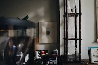 A cozy kitchen corner featuring a coffee machine with a steaming cup ready.