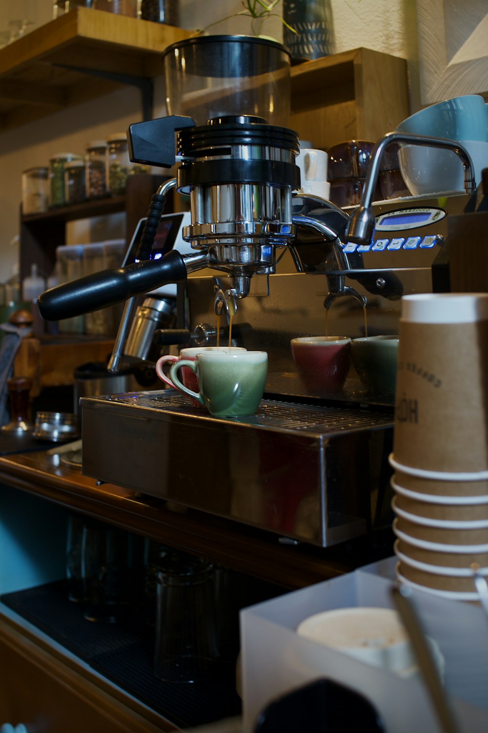 a coffee maker on a counter in a coffee shop