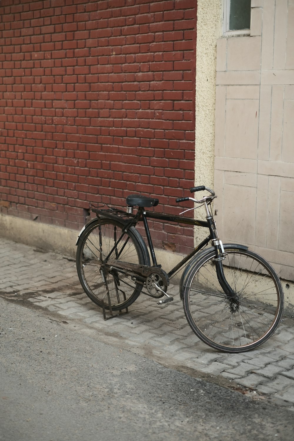 a bicycle parked on the side of a street