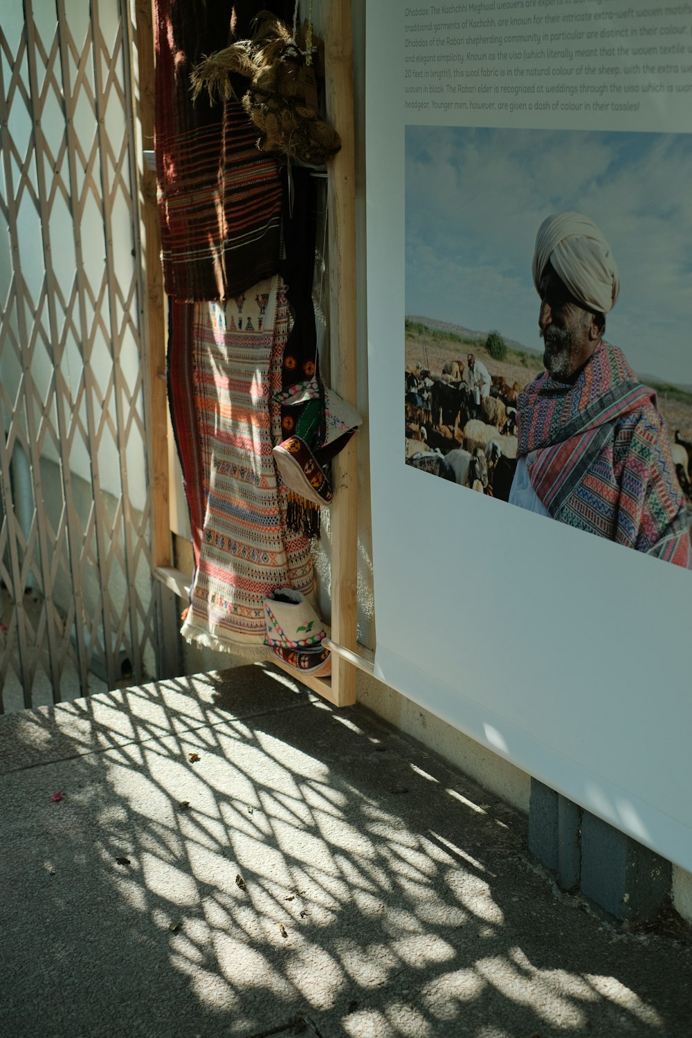 a man in a turban looking at a picture